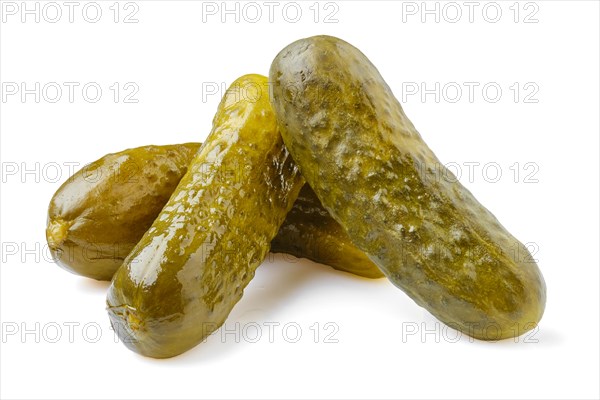 Three pickled cucumbers isolated on white background