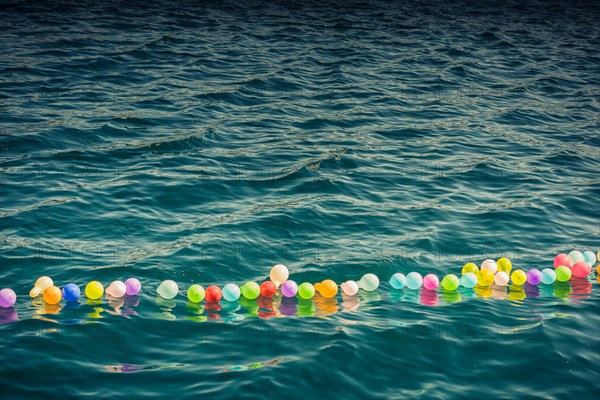 Balloon on a string on water for shooting game