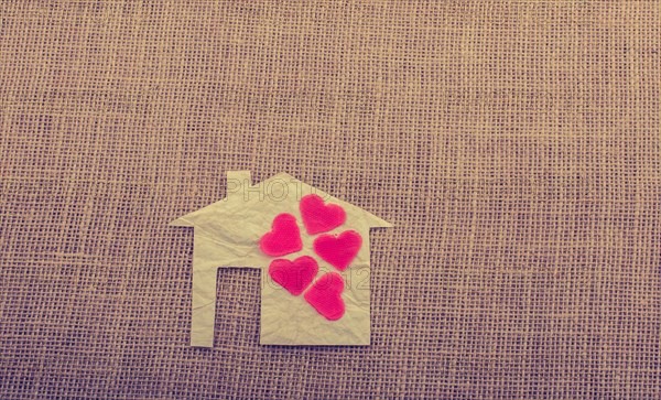 Model house and a heart shape beside it