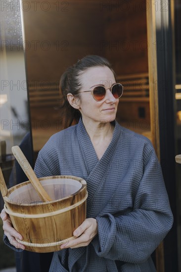 Woman taking a sauna