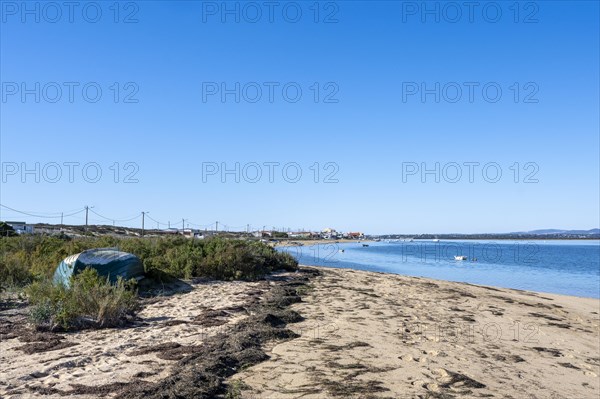 Boat on the beach of the Ria Formosa nature park Park