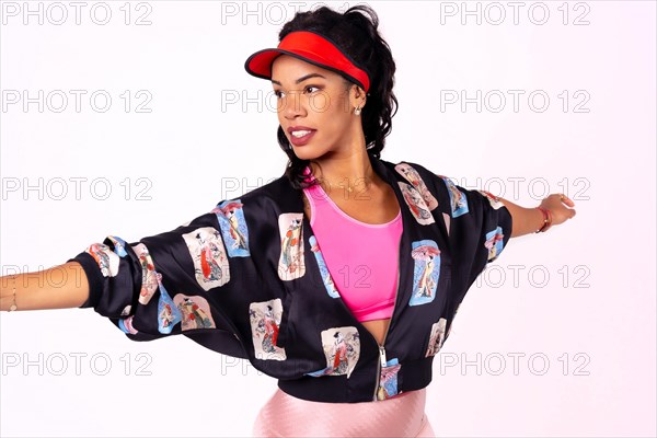 Black ethnic woman with cap dancing on a white background