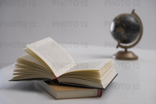 Book open with globe in the background