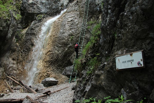 A tourist in the beautiful gorges of the Slovak Paradise National Park. Slovakia