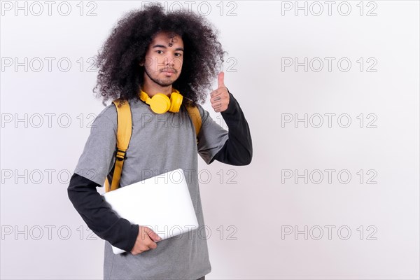 Young man with afro hair on white background