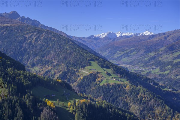 Snow-covered mountains above the Ulten Valley behind Zufrittspitze Tuferspitze and Hasenoehrl seen from the Pfrollnhof wine tavern