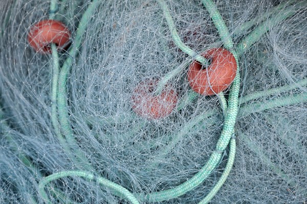 Fishing net with floats and ropes