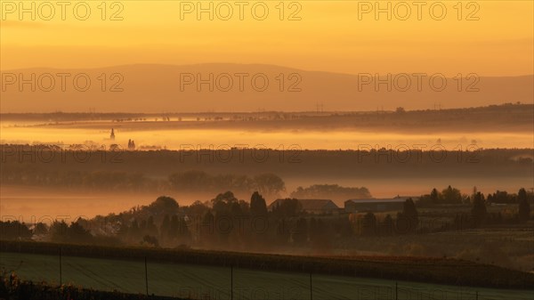 Foggy sunrise over fields in Bohemian Moravia