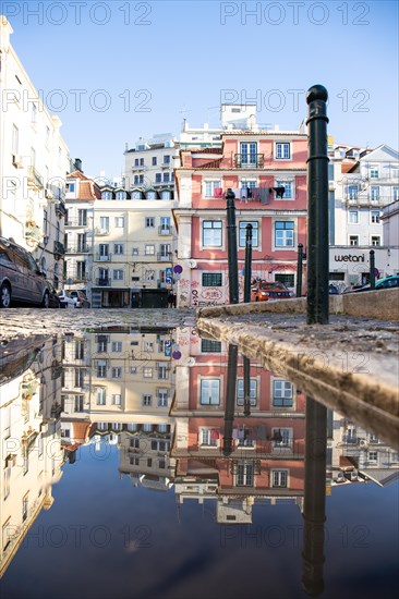 Old houses in narrow alleys and historic streets. Old house fronts in the morning and in the sunshine with reflection