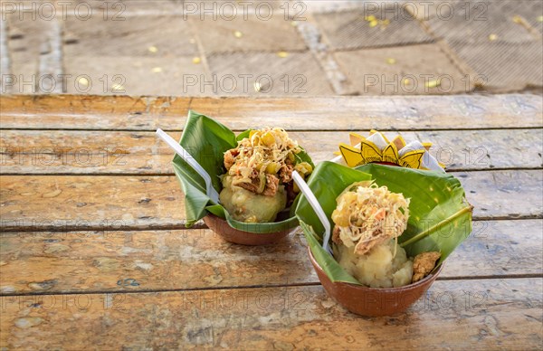 Two Nicaraguan vigorones served on wood. The vigoron typical food of Granada