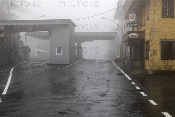 Border between Austria and Italy at the Ploecken Pass. The unoccupied and abandoned border crossing has a particularly mystical effect in fog