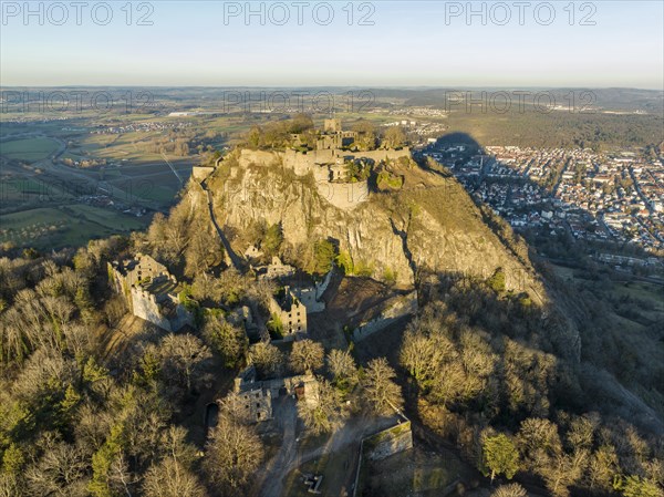 The volcanic cone Hohentwiel with the castle ruins illuminated by the evening sun
