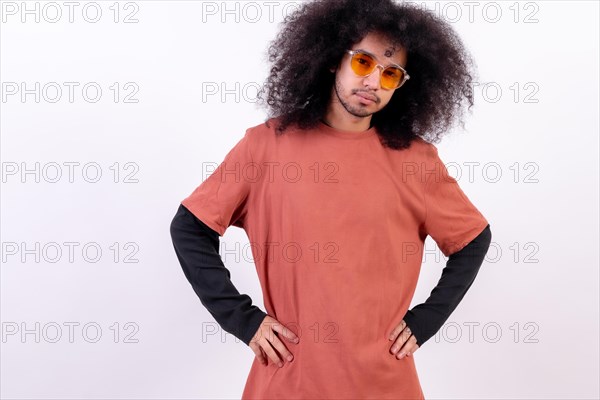Portrait with sunglasses smiling. Young man with afro hair on white background