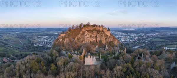 Panorama of the volcanic cone Hohentwiel with the castle ruins illuminated by the evening sun