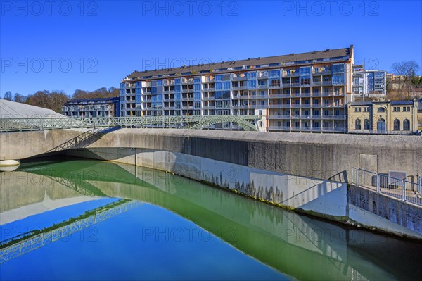 Old renovated spinning mill and weir