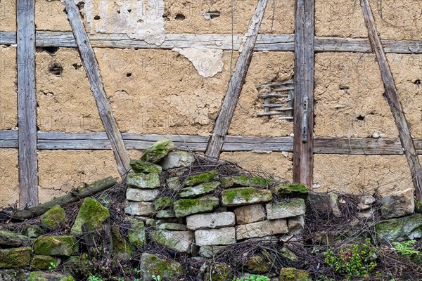 Dilapidated wall and old half-timbered wall