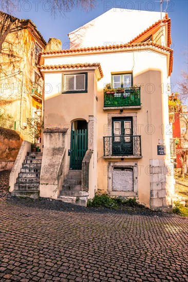 Old houses in narrow alleys and historic streets. Old house fronts in the morning and in the sunshine. the old town of alfama