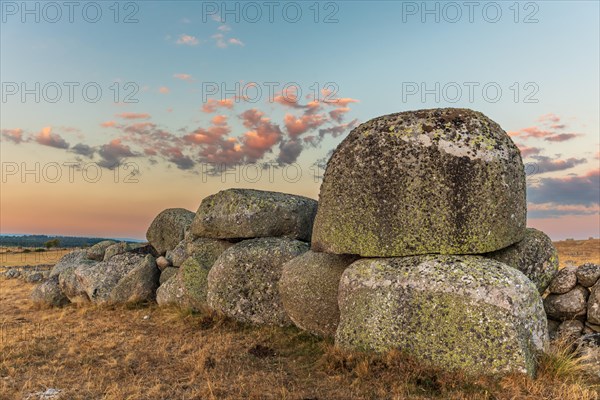 Rocks in the landscape at sunset. Aubrac