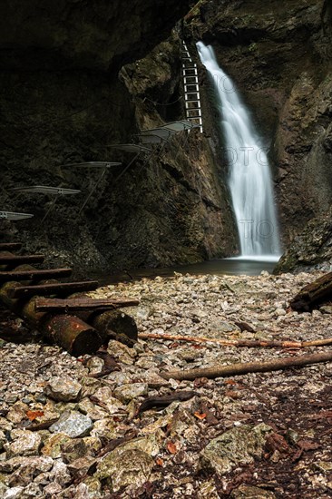 Difficul trail with ladder near the waterfall in canyon of National park Slovak paradise