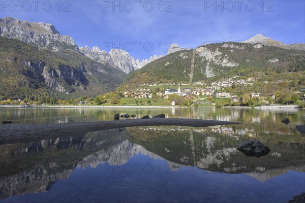 Mountains of the Brenta Group reflected in a small lagoon of Lake Molveno