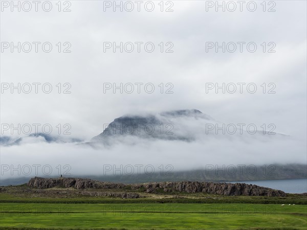 Lonely mountainside in the fog