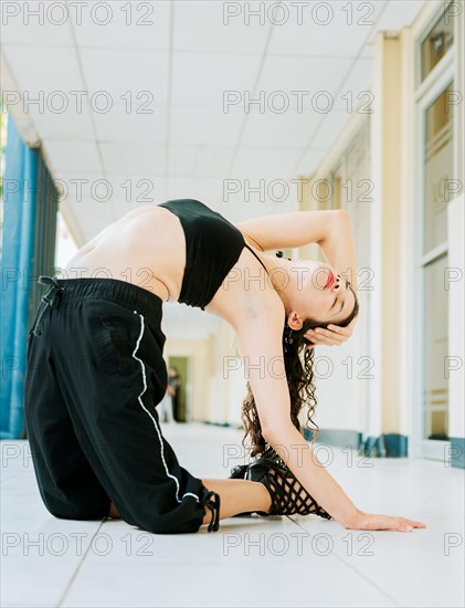 Portrait of woman dancer in heels doing yoga flexibilities