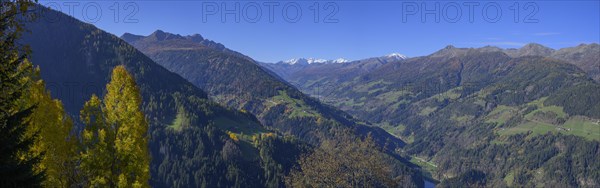 Snow-covered mountains above the Ulten Valley behind Zufrittspitze Tuferspitze and Hasenoehrl seen from the Pfrollnhof wine tavern