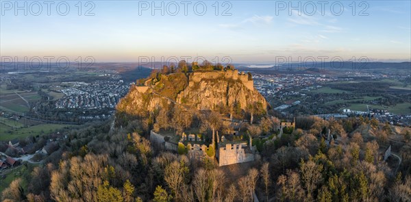 Panorama of the volcanic cone Hohentwiel with the castle ruins illuminated by the evening sun