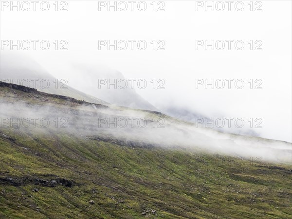 Clouds of fog drift across lonely plateau