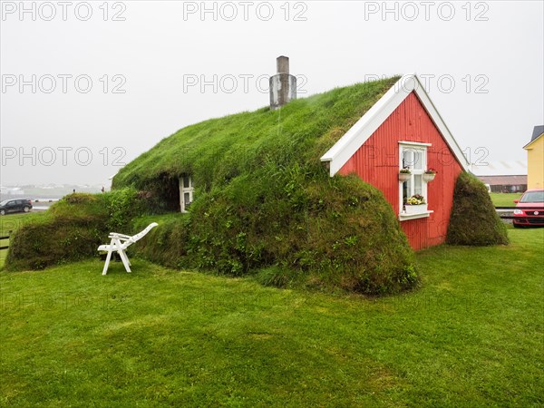 Traditional wooden house protected with peat from 1899