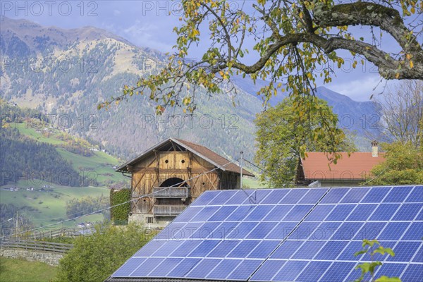 Old wooden house and roof with photovoltaics