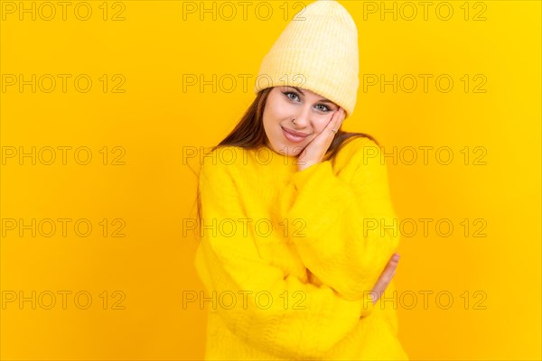 Thinking woman with many ideas with copyspace on yellow background