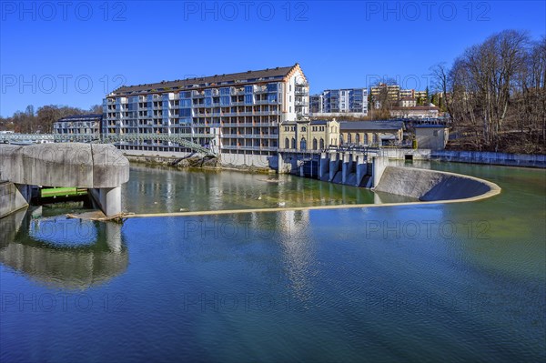 Old renovated spinning mill and weir