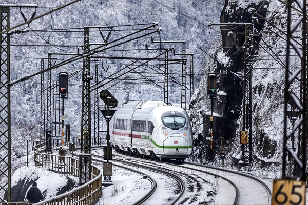 InterCityExpress ICE of Deutsche Bahn drives through the snow