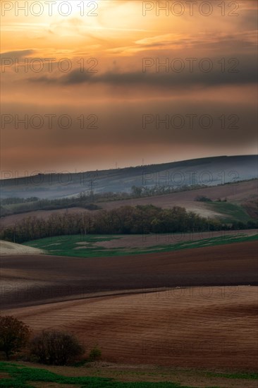 Beautiful view at sunset on the brown fields of Czech Moravia
