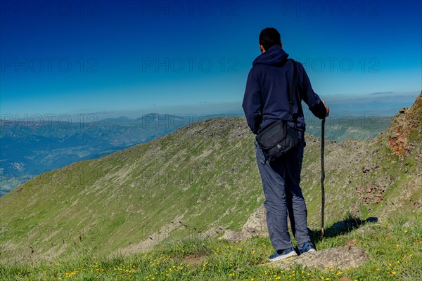 Hikers with backpacks and trekking poles walking in Turkish highland