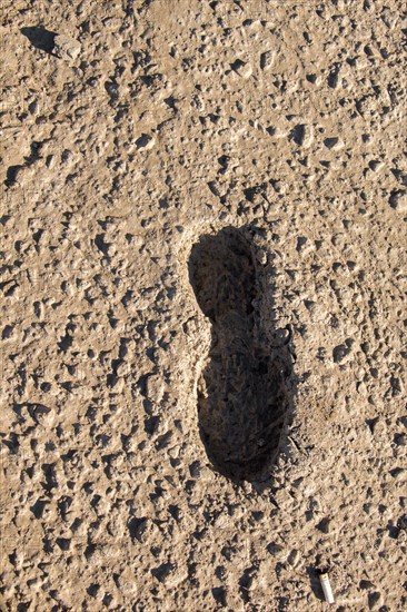 Footstep pattern seen on a concrete background