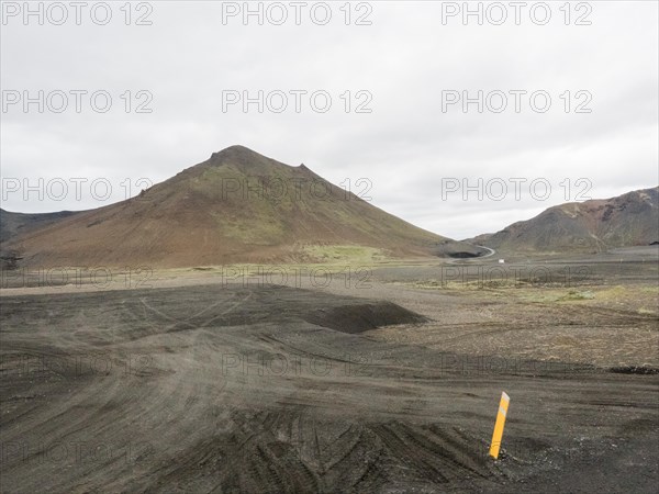 Rough track and barren mountains