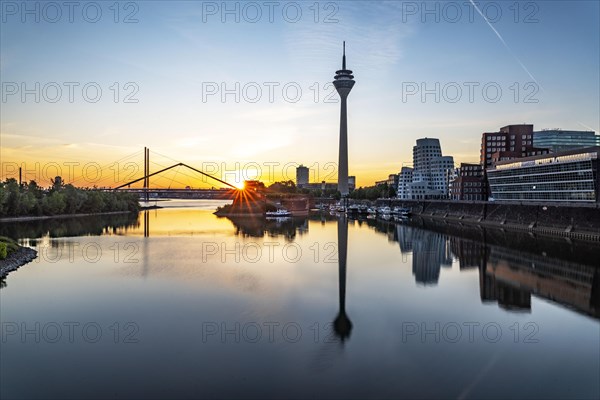 Media harbour at sunrise with view of Rhine tower and Rhine knee bridge