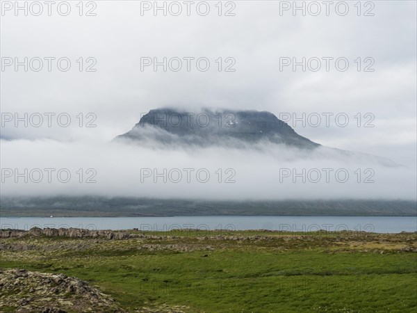 Lonely mountainside in the fog