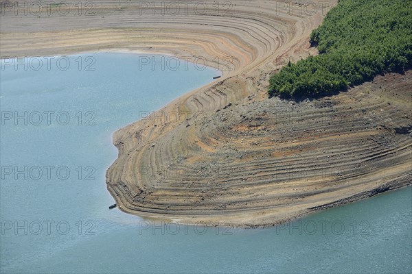 Little water in the Fierza reservoir with dry shore