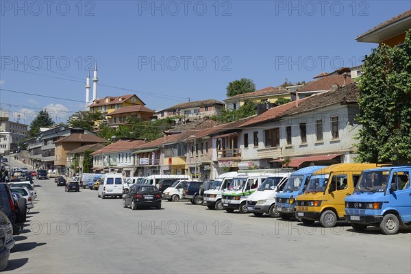 Old Mercedes buses at the bus station of the city of Peshkopi