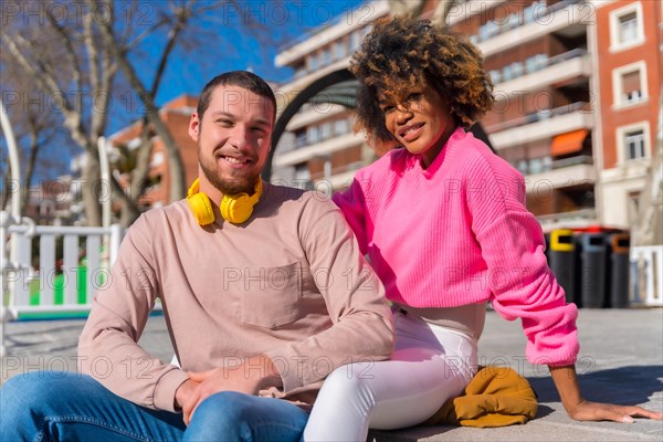 Multiracial couple through the city streets