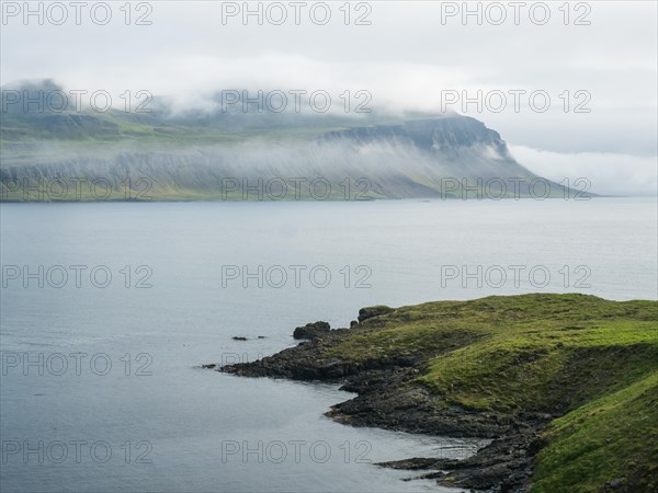 Fog over a fjord