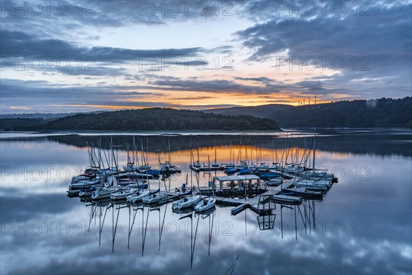 Blue hour over the Schwammenauel reservoir with sailing marina