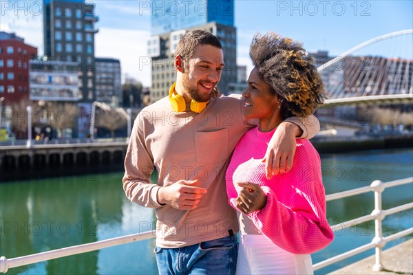 Multiracial friends through the city streets