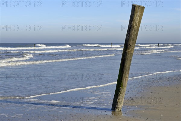 Leaking waves on the north beach with boundary pile