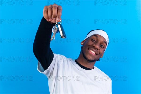 Black ethnic man in white clothes on a blue background