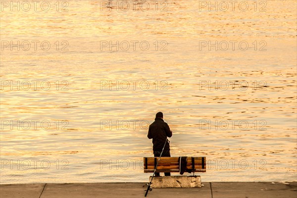 Fisherman by the sea fishing boat in the waters of the sea