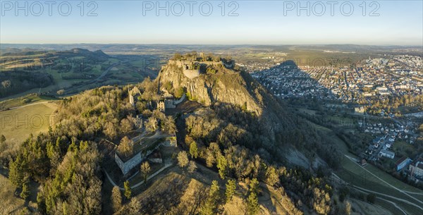 Panorama of the volcanic cone Hohentwiel with the castle ruins illuminated by the evening sun